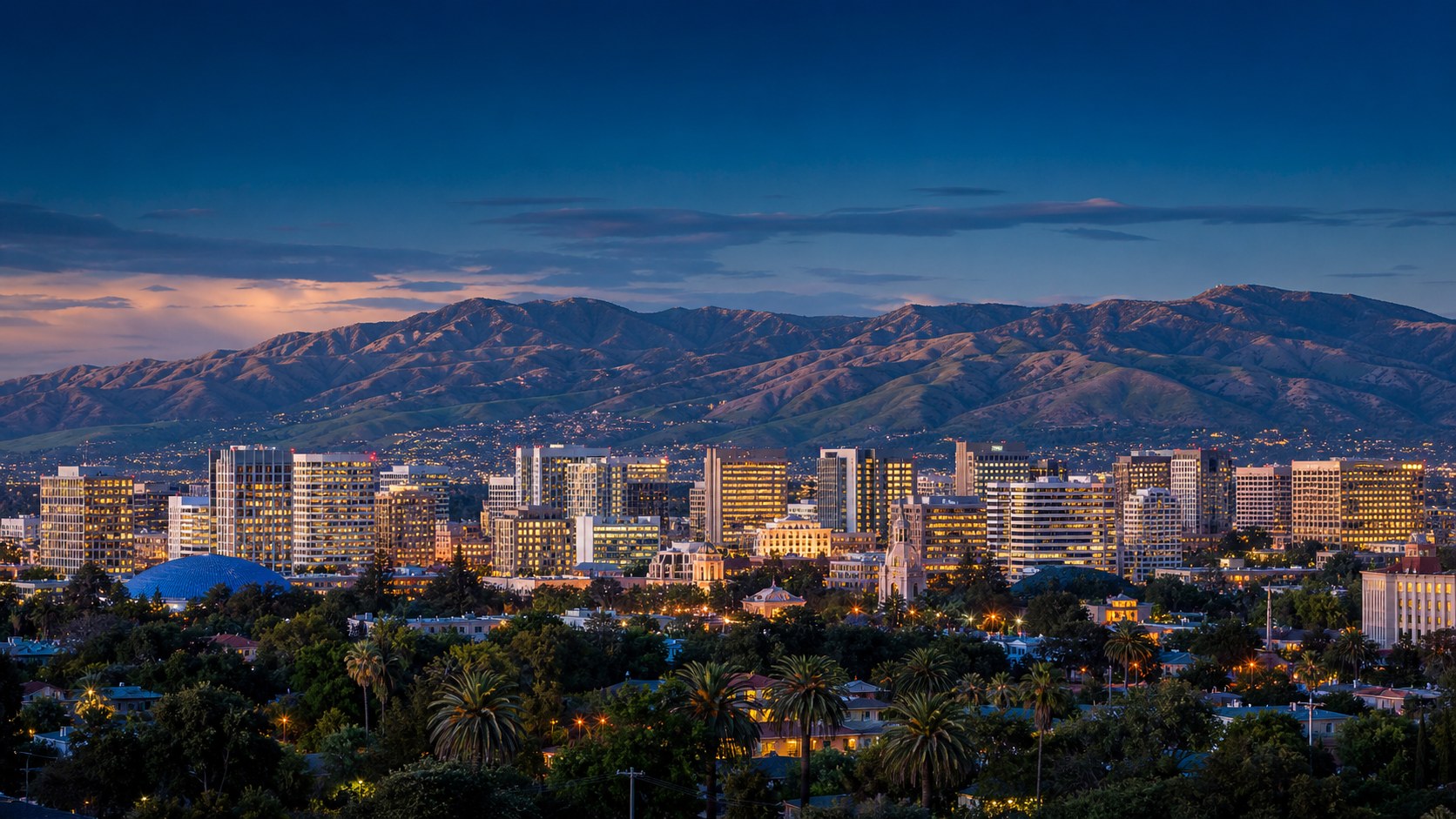 Downtown San Jose skyline at dusk with the Diablo Range behind